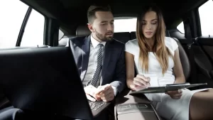 Men and women discussing something is the back seat of Southfield Cab